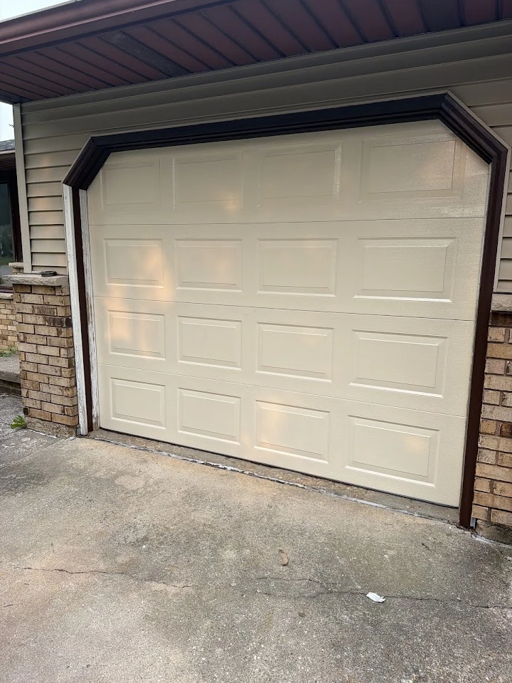 A clean, beige residential garage door.