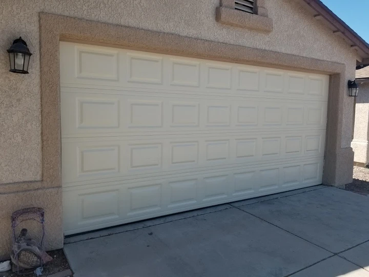 Clean beige garage door by Yoel's Affordable Garage.