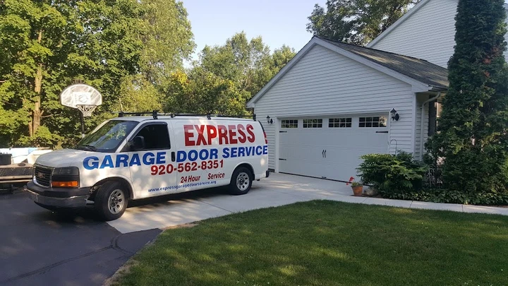 Express Garage Door Service van at a home.