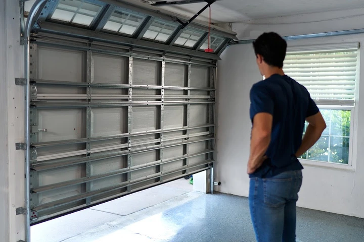 Man looking at a Precision Garage Door in Green Bay.