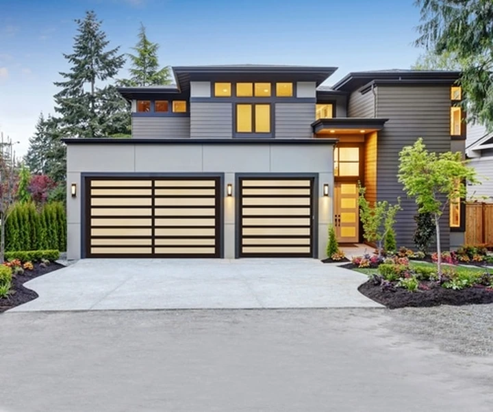 Modern home with Valley Overhead Door garage doors.