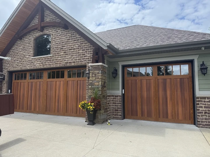 Modern wooden garage doors with windows.