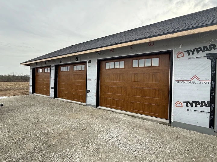 Three garage doors by Alpine Garage Doors.