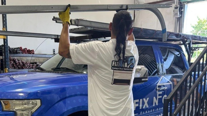 A technician loading a truck for Fix N Go service.