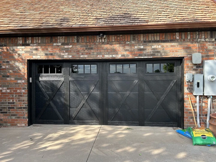 Black garage door by Willow Creek Overhead Door.