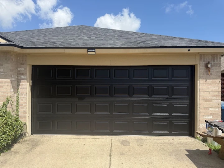Black residential garage door by Corpus Christi Overhead Door.