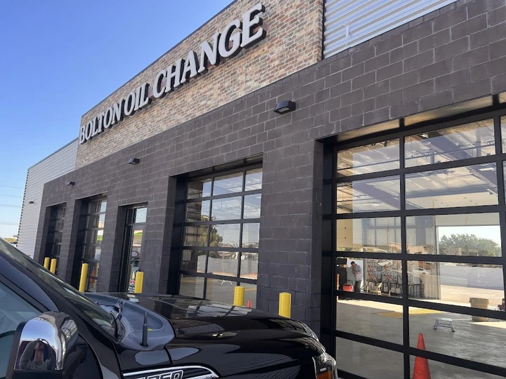 Bolton Oil Change with commercial glass garage doors.