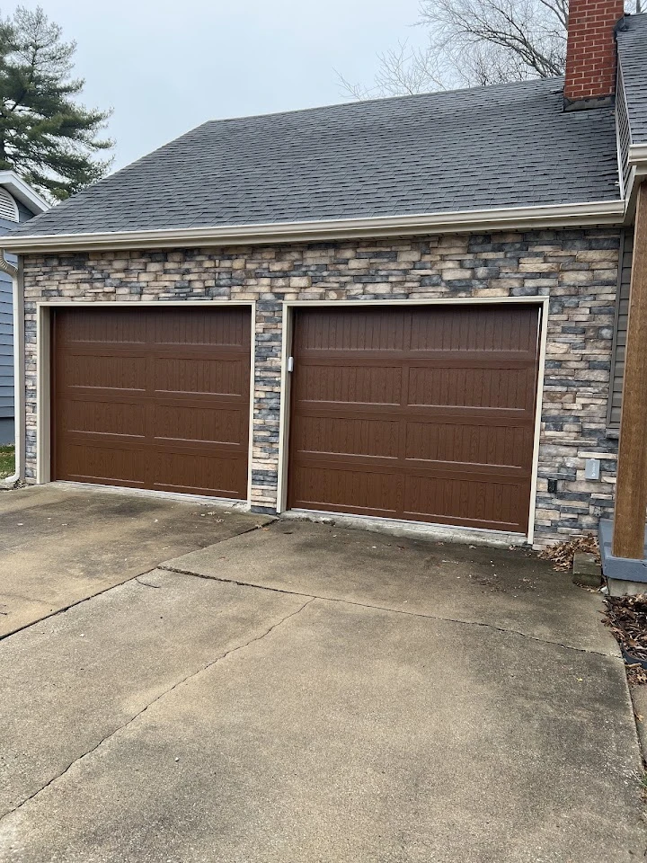 Brown carriage-style garage doors.