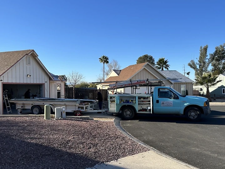 Budget Garage Doors & Service truck at a job site.