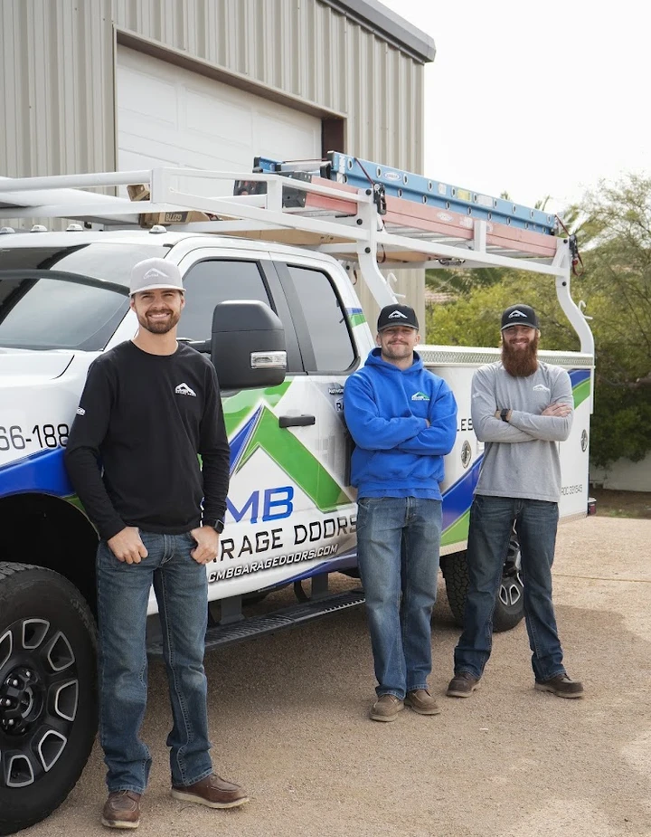 CMB Garage Doors team standing by their truck.