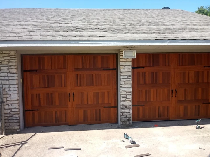 Custom wood carriage-style garage doors by Hewitt.