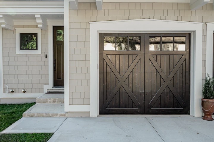 Dark wood farmhouse-style garage door.
