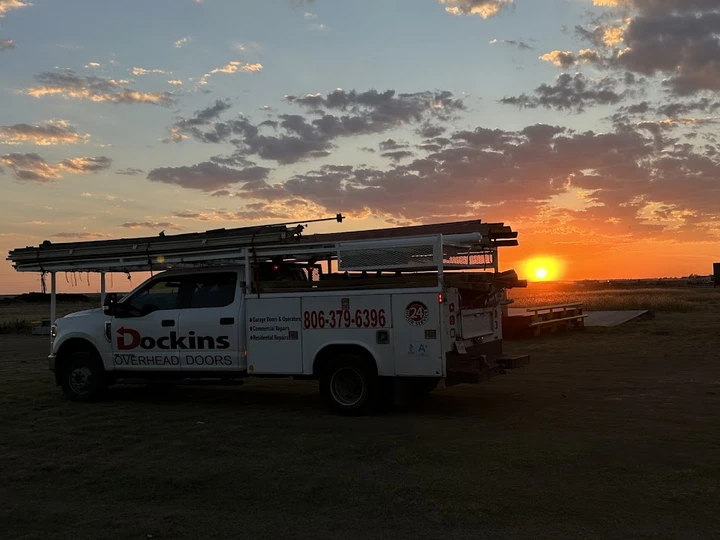 Dockins Overhead Doors truck at sunset.