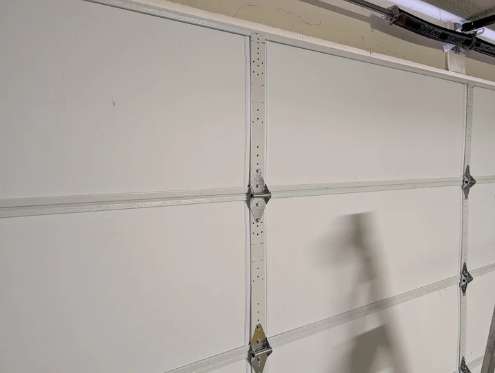 Garage door interior center stile and hinges.