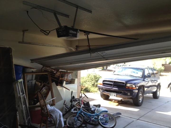 Garage door off track and in need of repair.