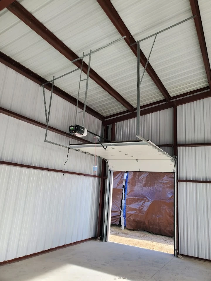 Garage door opener installation in a metal building.