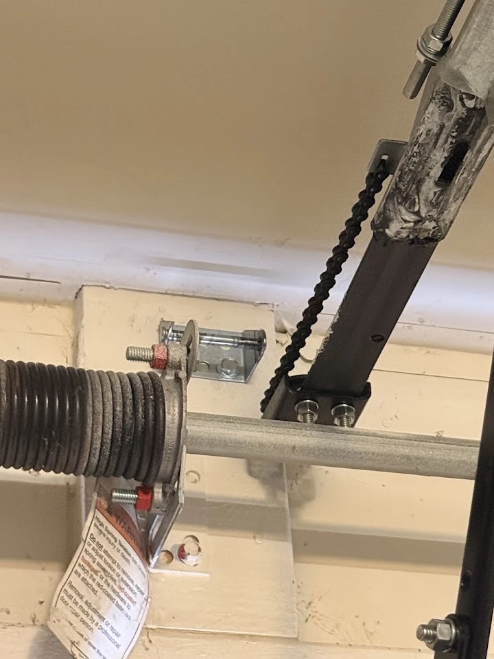 Garage door torsion spring and center bearing bracket.