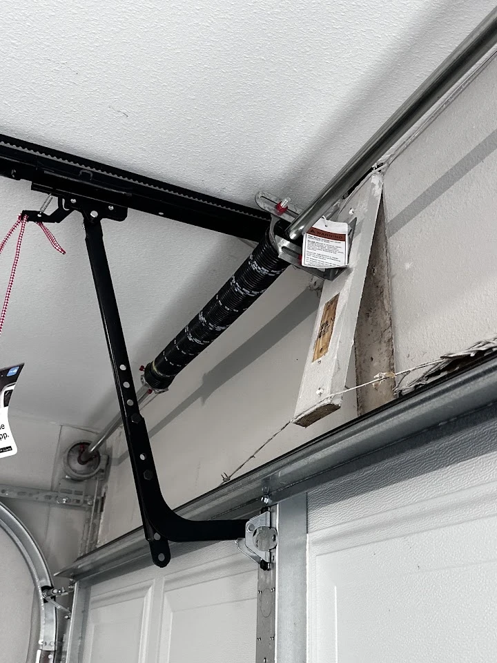 Garage door torsion spring and header mount.