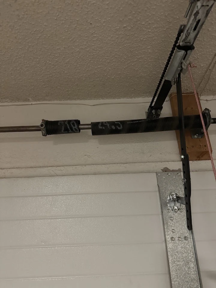 Garage door torsion spring and mechanism.