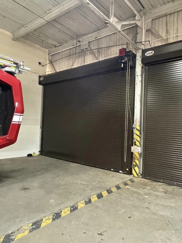 Industrial overhead rolling door in a fire station.