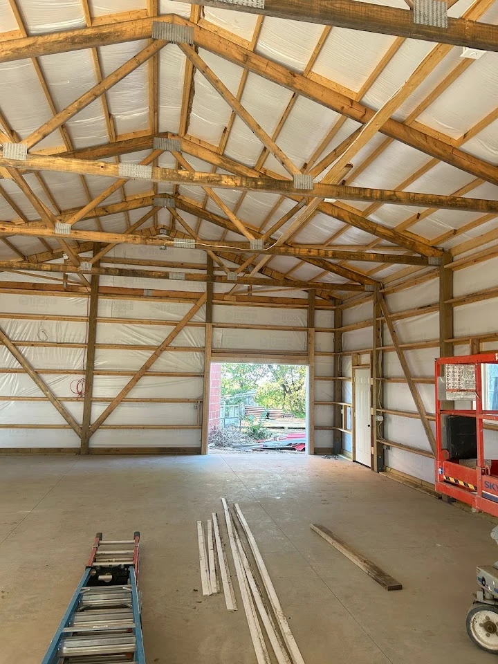 Interior of a pole barn under construction.