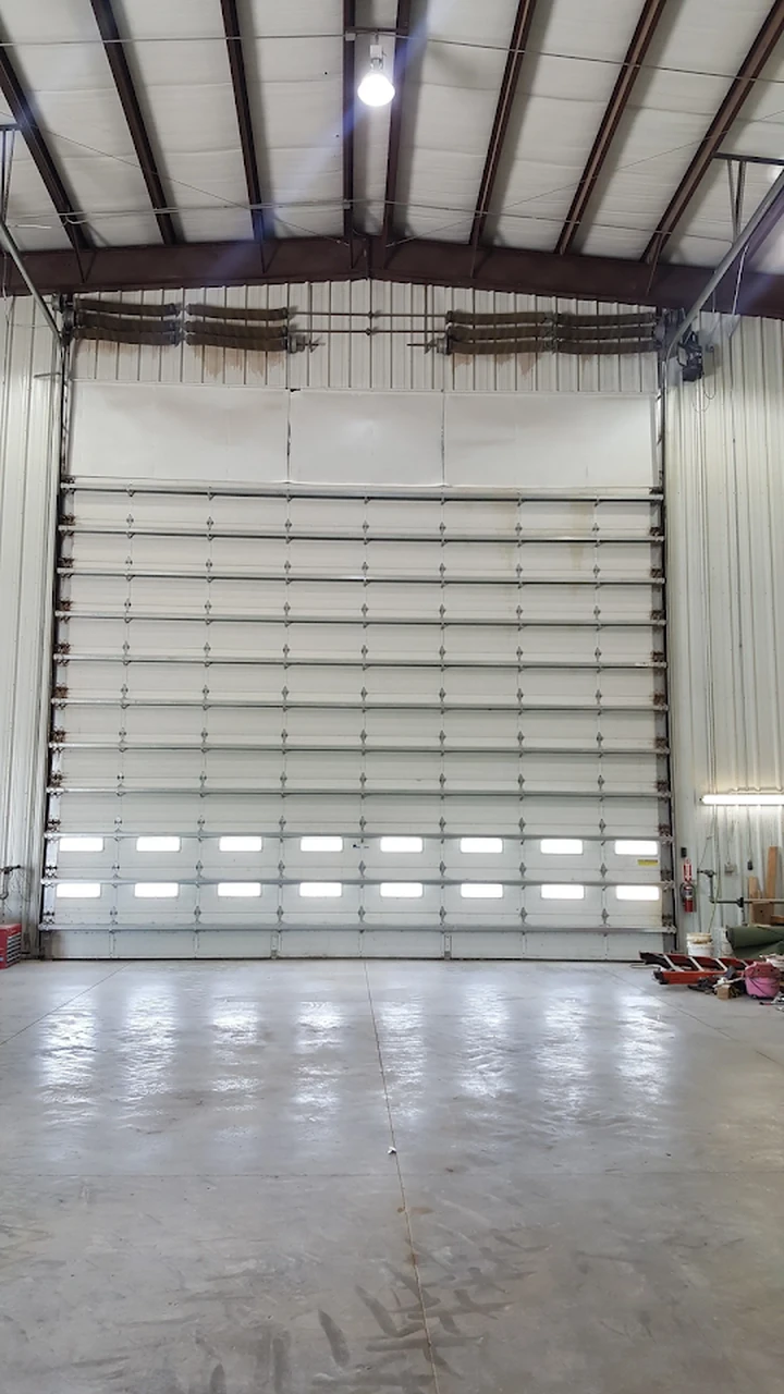 Large white commercial overhead garage door.