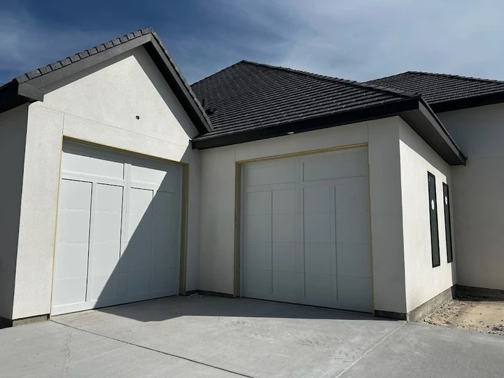 Modern garage doors by All Doors and More LLC.