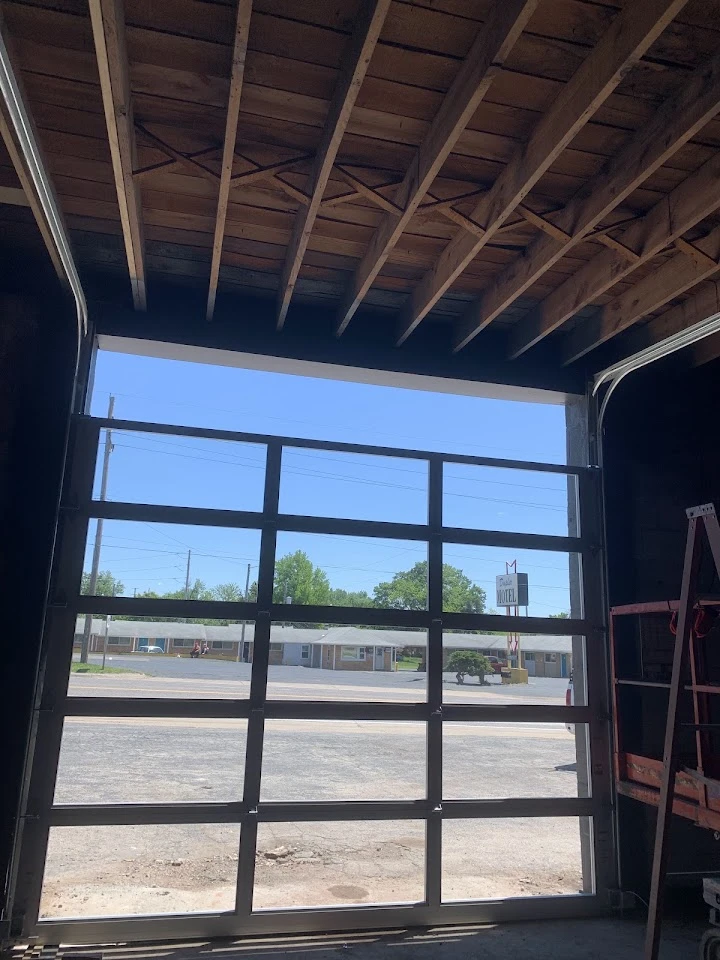 Modern glass garage door installed by RS Garage Door.
