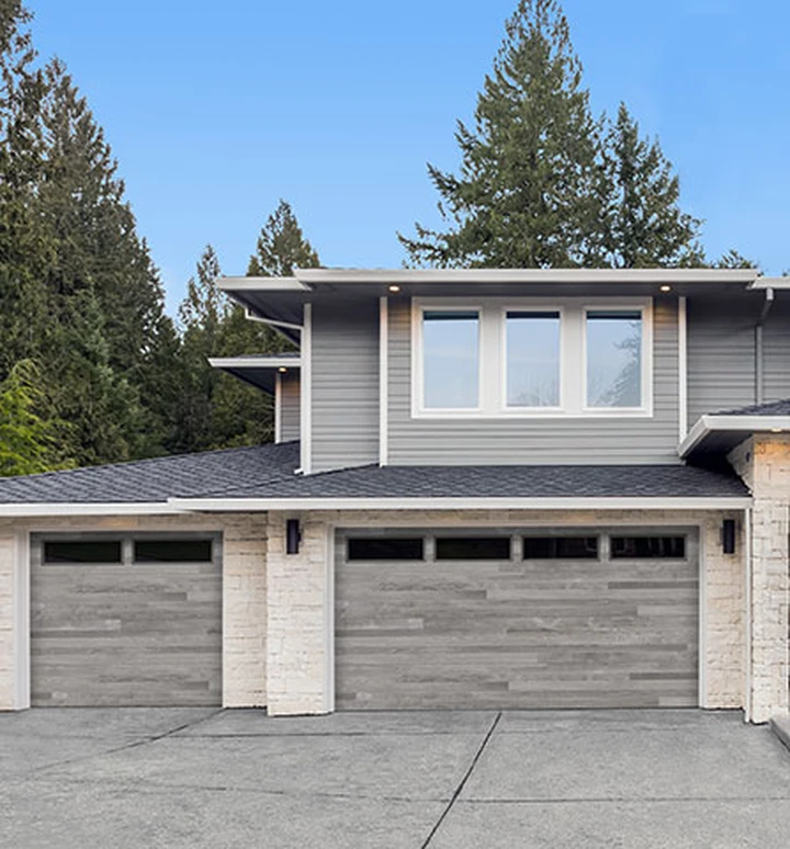 Modern grey garage doors with windows.