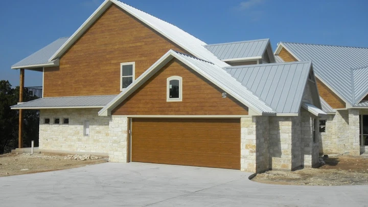 Modern suburban home with brown garage door.