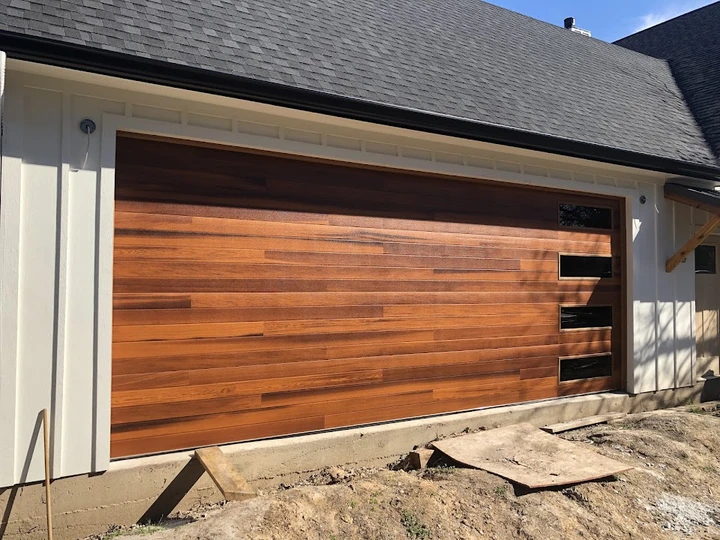 Modern wood garage door by Hewitt Garage Doors.