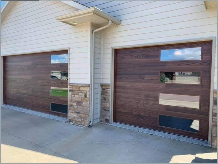Modern wood-look garage doors by Best Team Overhead.