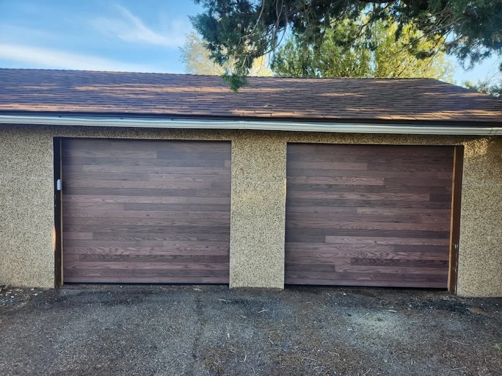 Modern wood-look garage doors by Integrity Overhead Door.