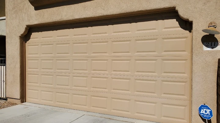 Monkey Garage Door's beige residential garage door.