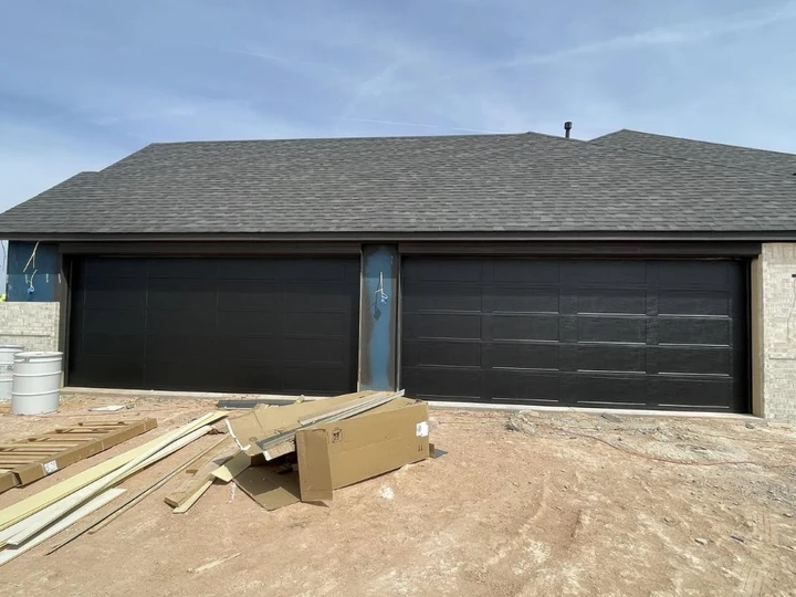 New black garage doors installed by Integrity.