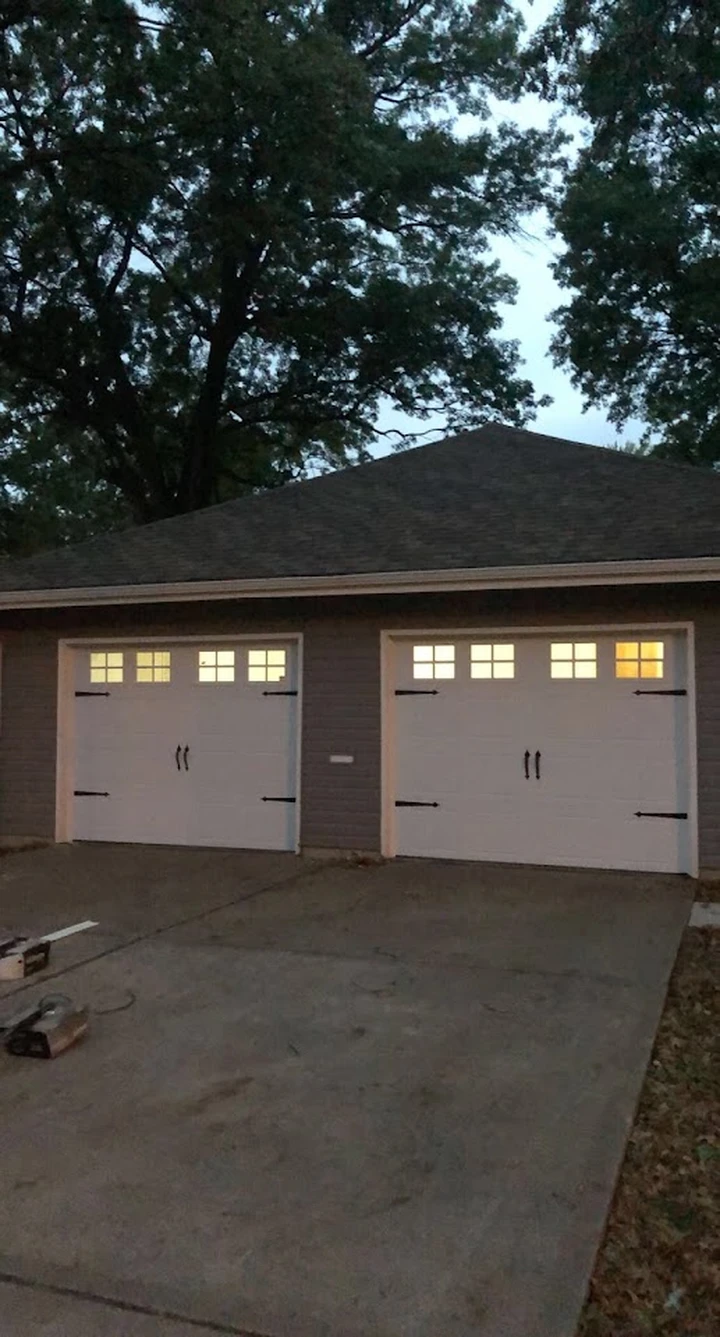 New white garage doors by Right Way Garage Doors LLC.