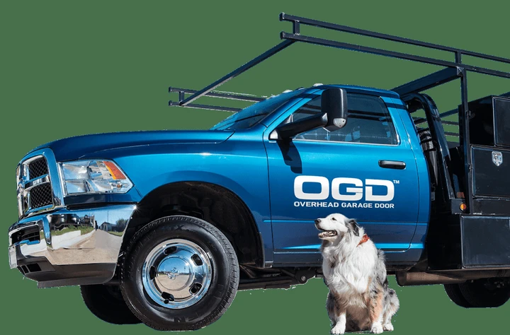 OGD Overhead Garage Door truck with an Australian Shepherd.