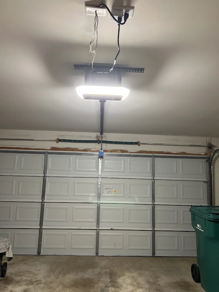 Precision Garage Door opener on a residential door.