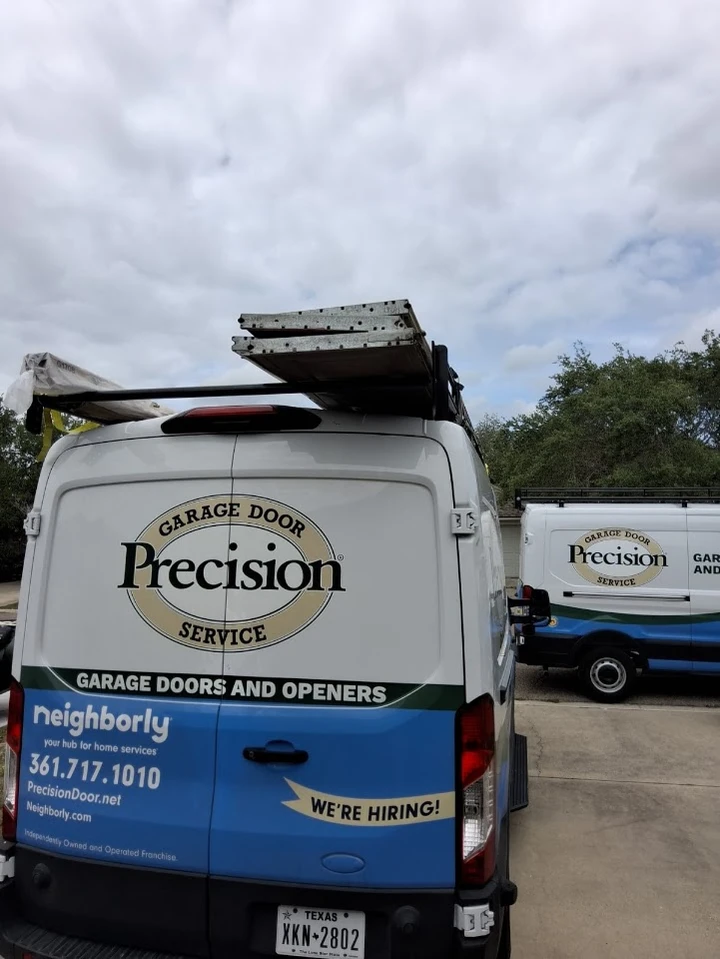 Precision Garage Door Service vans in Texas.