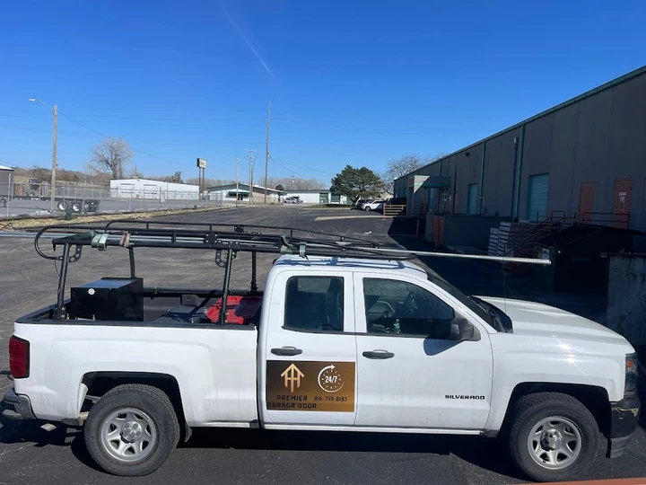 Premier Garage Door truck in a parking lot.