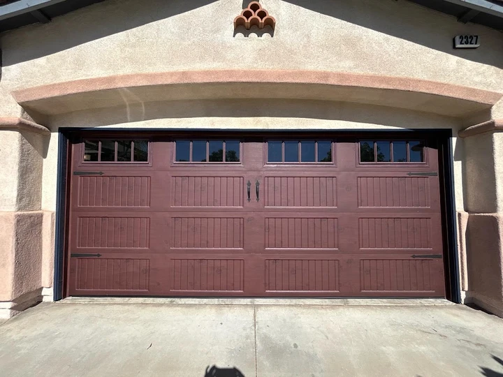 Premier Garage Doors: A custom dark brown carriage door.