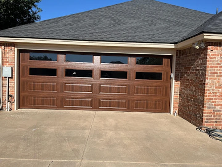 Raider Garage Doors brown faux wood garage door.