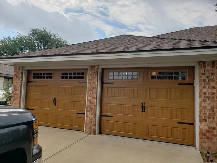 Raider Garage Doors: two wood-look garage doors.