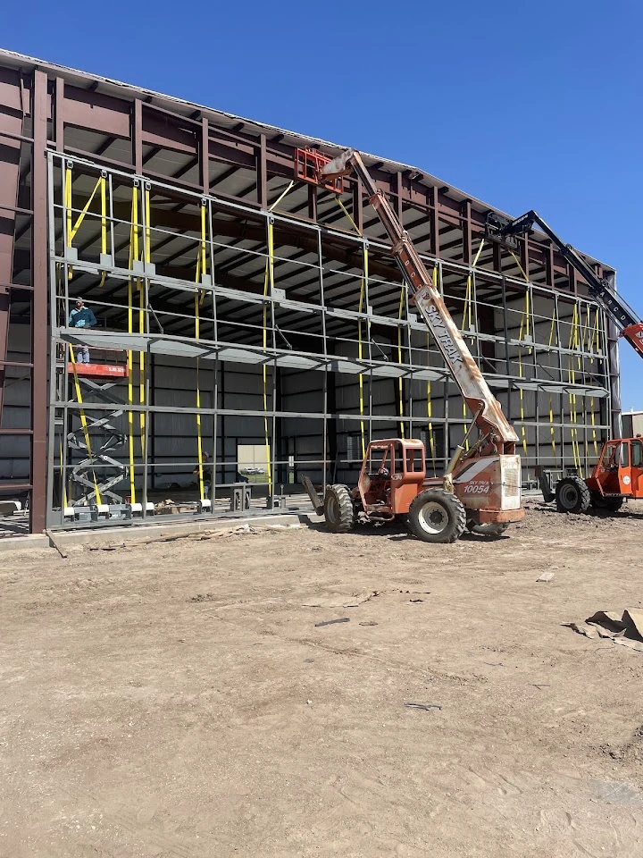 Reliant Overhead Door installing a large door frame.