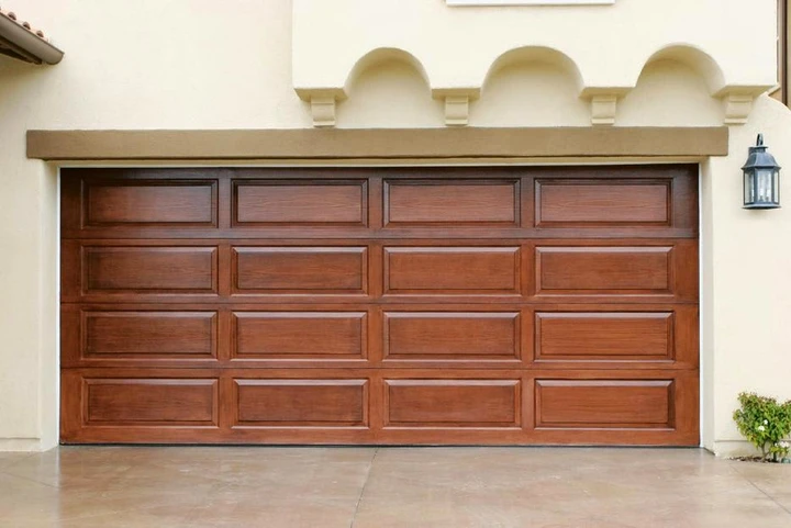 Renner Garage Door with a wooden panel design.