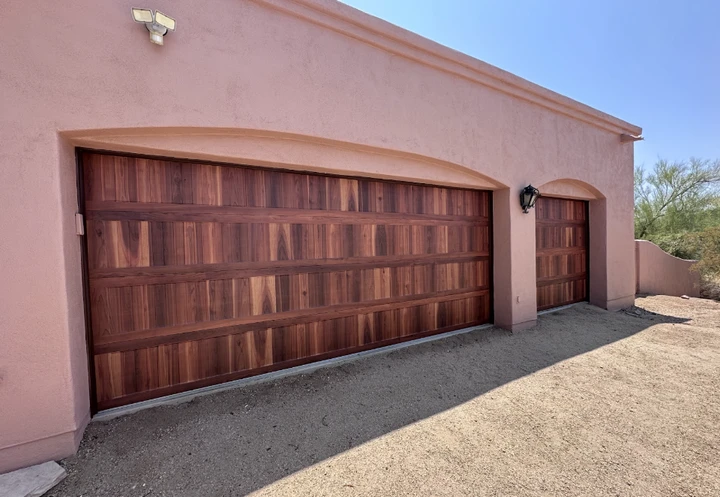 Stunning wood garage doors by CMB Garage Doors.