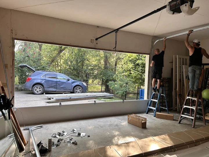 Technicians installing a garage door in Florissant.