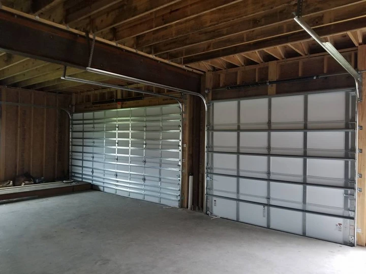 Two modern garage doors installed by Triple A.