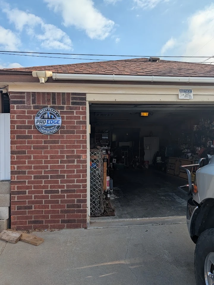 West Texas ProEdge Contractors garage with logo.
