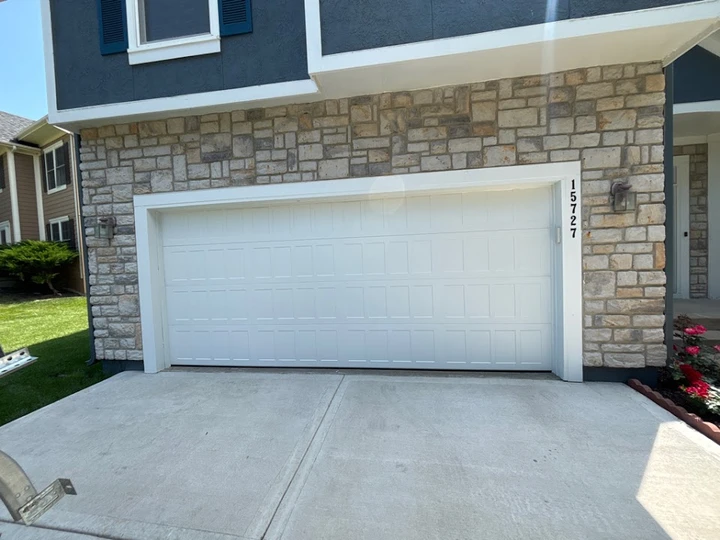 White garage door with house number 15727.
